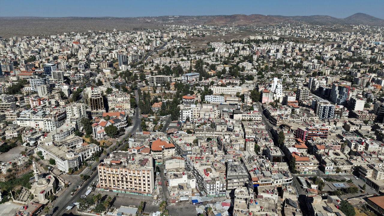 FILE PHOTO: A drone view shows the predominantly Druze city of Sweida, following deadly clashes between Druze fighters, Sunni Bedouin tribes and government forces, in Syria July 25, 2025. REUTERS/Khalil Ashawi/File Photo