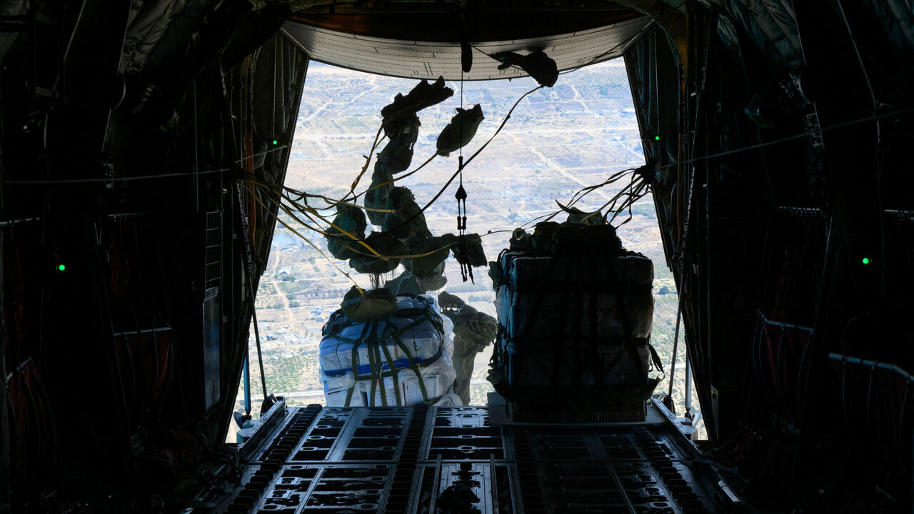 A Royal Canadian Air Force CC-130 Hercules transport aircraft airdrops some of approximately 21,600 lbs of humanitarian aid over the Gaza Strip August 4, 2025. Corporal Marc-Andre Leclerc/Canadian Forces/Handout via REUTERS