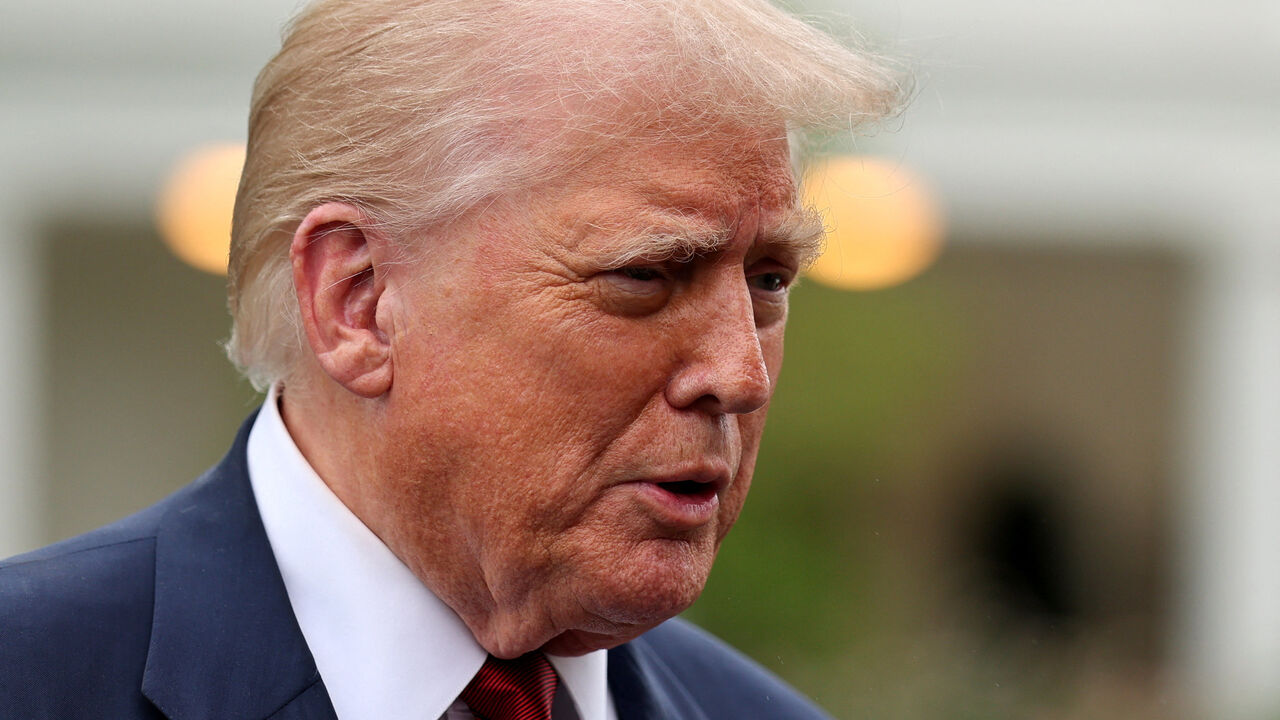 FILE PHOTO: U.S. President Donald Trump speaks to reporters ahed of boarding Marine One to depart for New Jersey, at the White House in Washington, D.C., U.S., August 1, 2025. REUTERS/Jonathan Ernst/File Photo