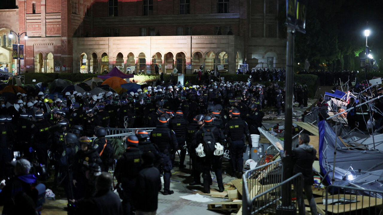 FILE PHOTO: Law enforcement officers stand guard at the University of California Los Angeles (UCLA), during a pro-Palestinian protest, as the conflict between Israel and the Palestinian Islamist group Hamas continues, in Los Angeles, California, U.S., May 2, 2024. REUTERS/Mike Blake/File Photo
