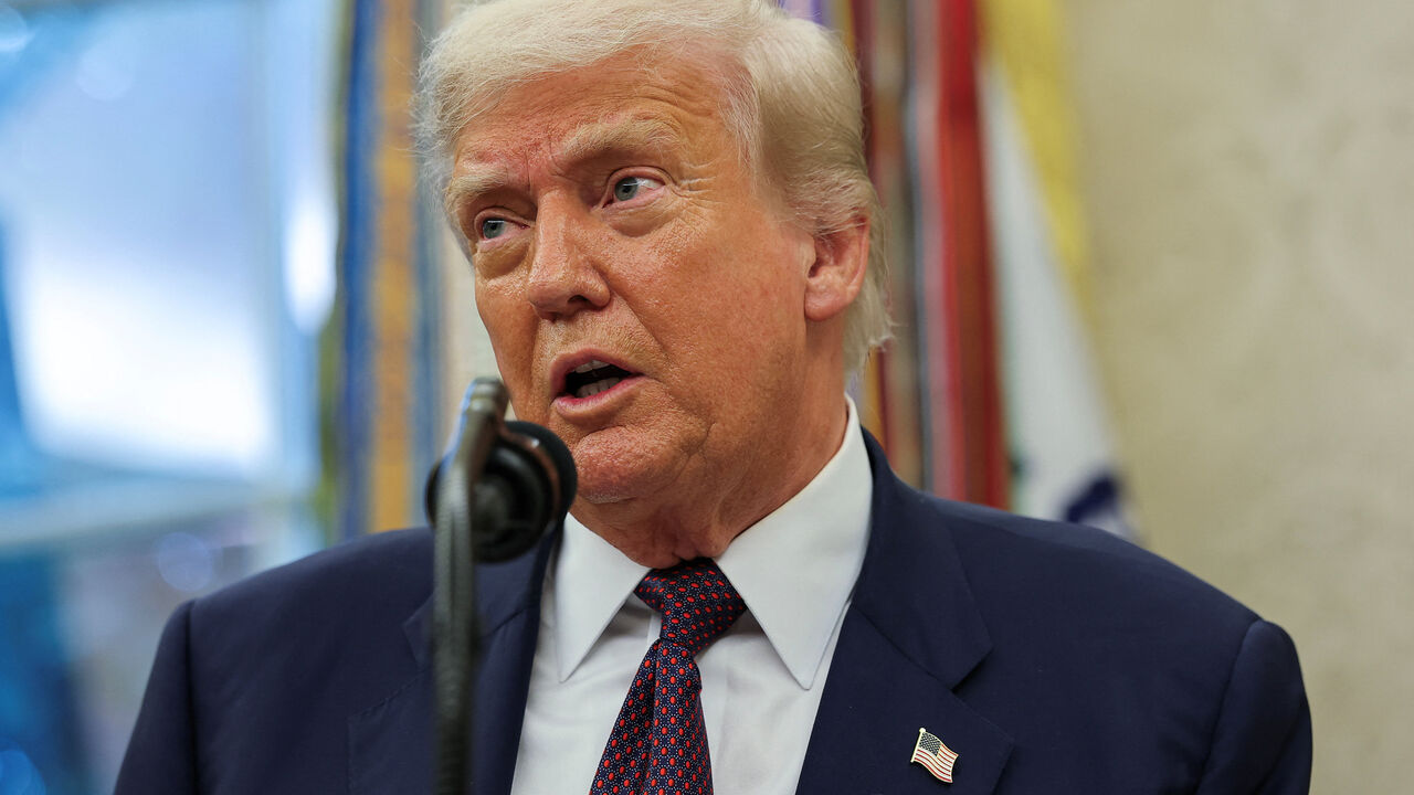 U.S. President Donald Trump speaks, as he and Apple CEO Tim Cook (not pictured) present Apple's announcement of a $100 billion investment in U.S. manufacturing, in the Oval Office at the White House in Washington, D.C., U.S., August 6, 2025. REUTERS/Jonathan Ernst