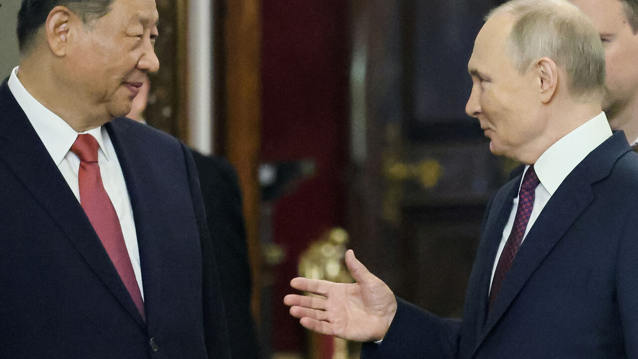 Russian President Vladimir Putin and Chinese President Xi Jinping speak during a meeting at the Kremlin in Moscow, Russia, May 8, 2025. Yuri Kochetkov/Pool via REUTERS/File Photo