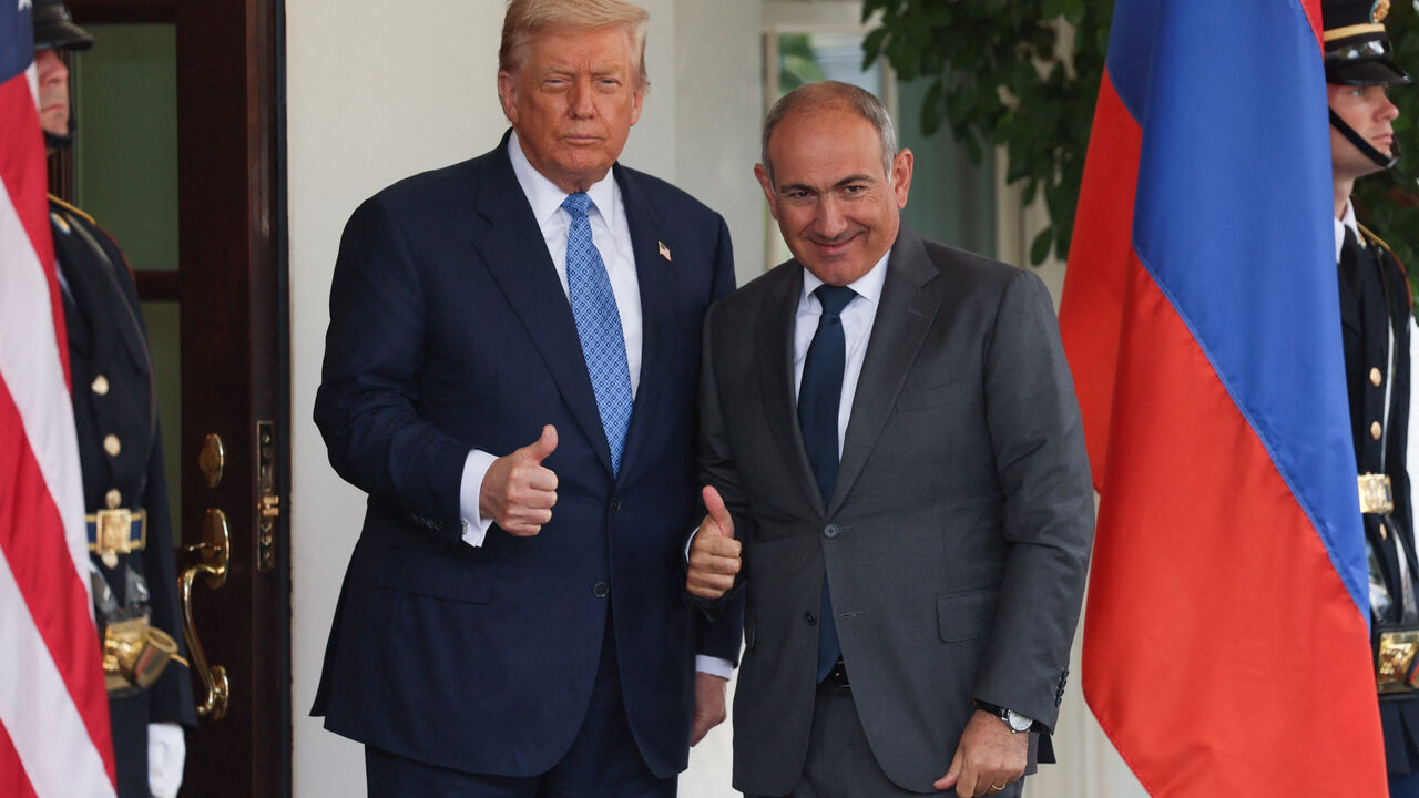U.S. President Donald Trump and Armenia's Prime Minister Nikol Pashinyan gesture at the White House in Washington, D.C., U.S., August 8, 2025. REUTERS/Jessica Koscielniak