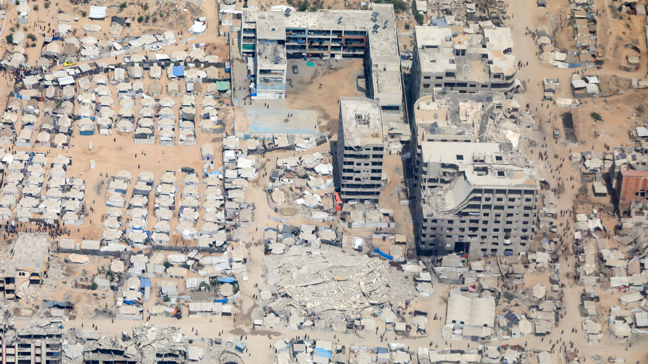 An aerial view from a Jordanian military aircraft shows the Gaza Strip, before humanitarian aid is airdropped over it, in Gaza, August 9, 2025. REUTERS/Alaa Al Sukhni