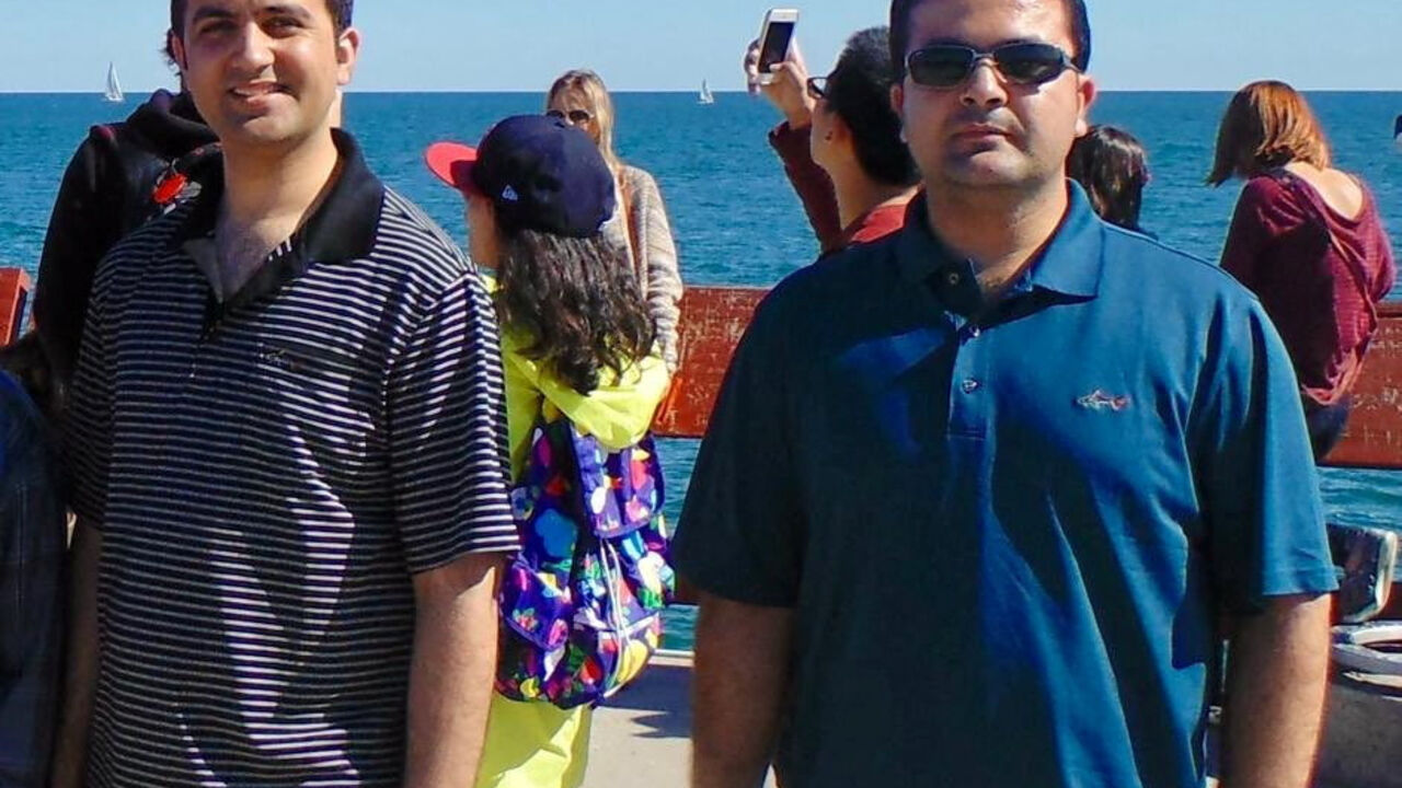 FILE PHOTO: Mahmood Habibi and his older brother Ahmad Habibi stand during a visit to Toronto, Canada, 2014. Mahmood Habibi was taken hostage by the Taliban in Afghanistan on August 10, 2022, according to the U.S. government. Ahmad Shah Habibi/Handout via REUTERS    THIS IMAGE HAS BEEN SUPPLIED BY A THIRD PARTY. NO RESALES. NO ARCHIVES./File Photo   REFILE - QUALITY REPEAT