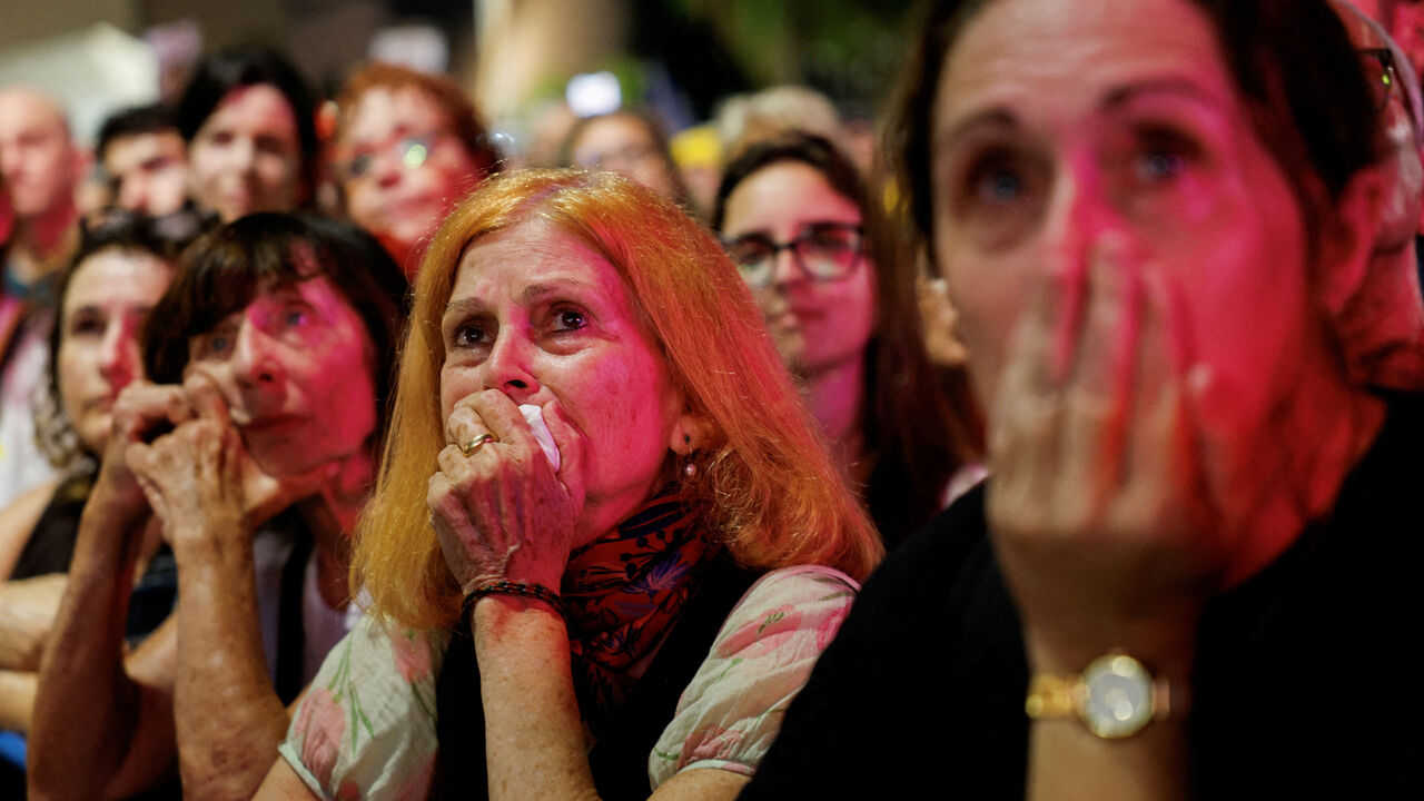 Demonstrators react, as they attend a protest demanding the immediate release of the hostages kidnapped during the deadly October 7, 2023 attack on Israel by Hamas, and the end of the war, in Tel Aviv, Israel, August 9, 2025. REUTERS/Amir Cohen