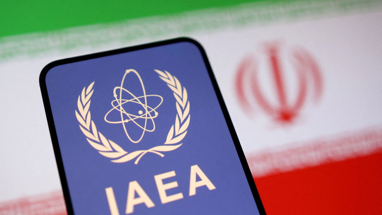FILE PHOTO: International Atomic Energy Agency (IAEA) logo and Iranian flag is seen in this illustration taken June 16, 2025. REUTERS/Dado Ruvic/Illustration/File Photo