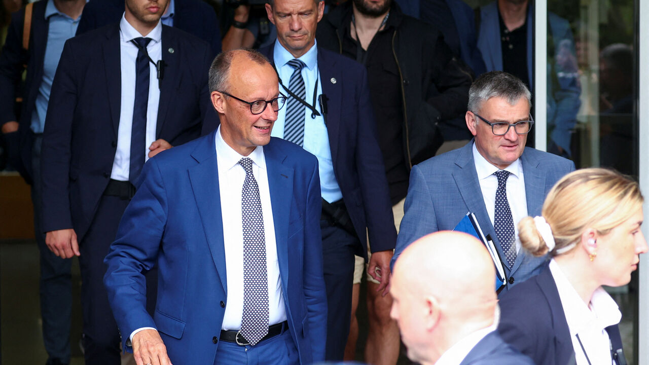 FILE PHOTO: German Chancellor Friedrich Merz walks after attending a press conference about domestic and foreign policy issues at the House of the 'Bundespressekonferenz' in Berlin, Germany July 18, 2025. REUTERS/Christian Mang/File Photo