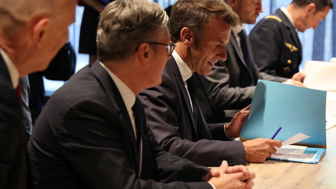 France's President Emmanuel Macron and Britain's Prime Minister Keir Starmer meet with Germany's Chancellor Friedrich Merz (not pictured) on the sidelines of the two-day NATO's Heads of State and Government summit, in The Hague, Netherlands June 24, 2025. Ludovic Marin/Pool via REUTERS/File Photo