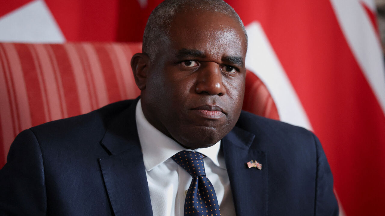 FILE PHOTO: British Foreign Secretary David Lammy looks on as he meets with U.S. Vice President JD Vance (not pictured) at Chevening House in Sevenoaks, Britain, August 8, 2025. REUTERS/Suzanne Plunkett/Pool/File photo