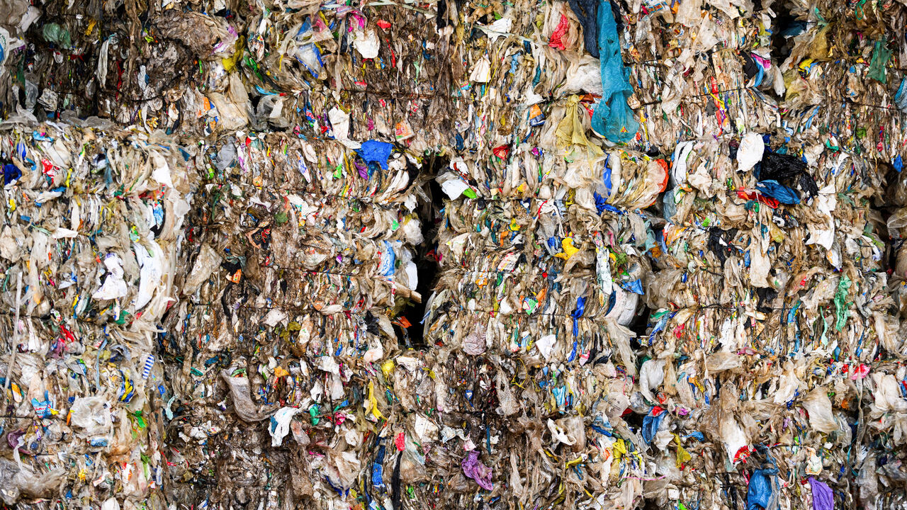 FILE PHOTO: Stacked bundles of plastic trash lie at the waste sorting plant of recycling company Remondis in Erftstadt, Germany, August 12, 2025. REUTERS/Jana Rodenbusch/File Photo