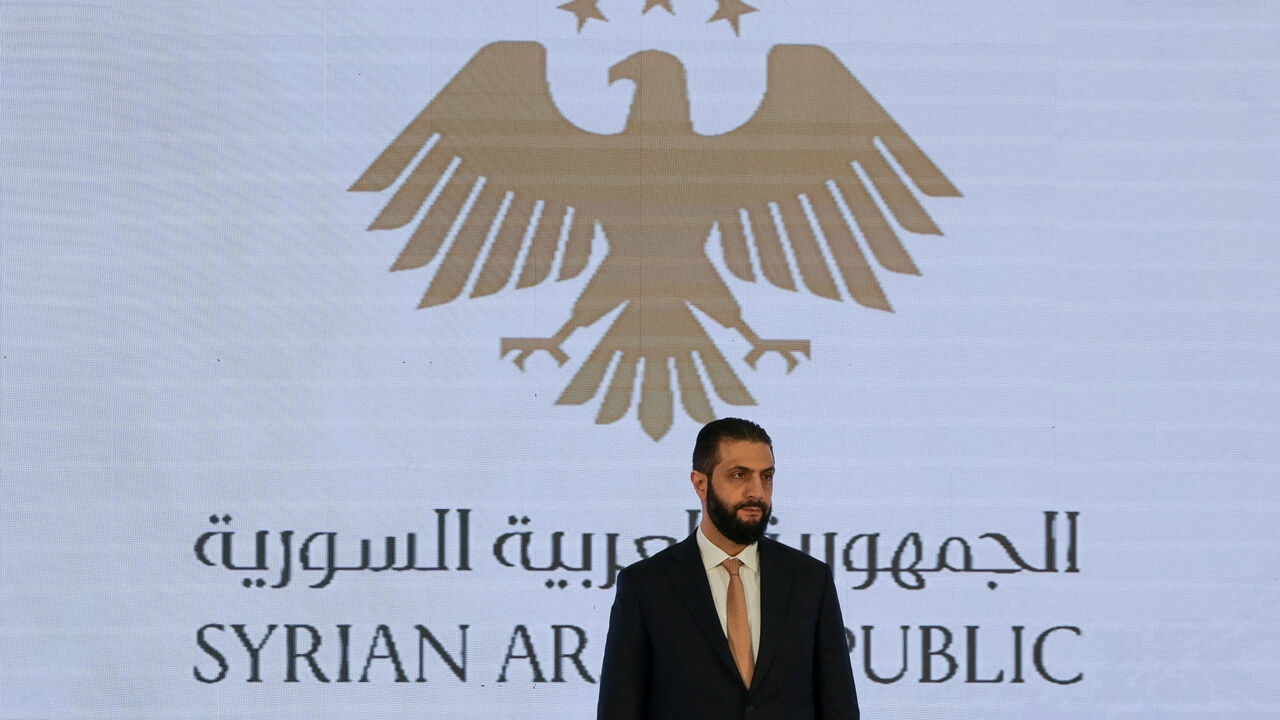 Syrian President Ahmed al-Sharaa attends a signing ceremony of a memorandum of understanding for investment in Syria, in Damascus, Syria August 6, 2025. REUTERS/Khalil Ashawi/File Photo