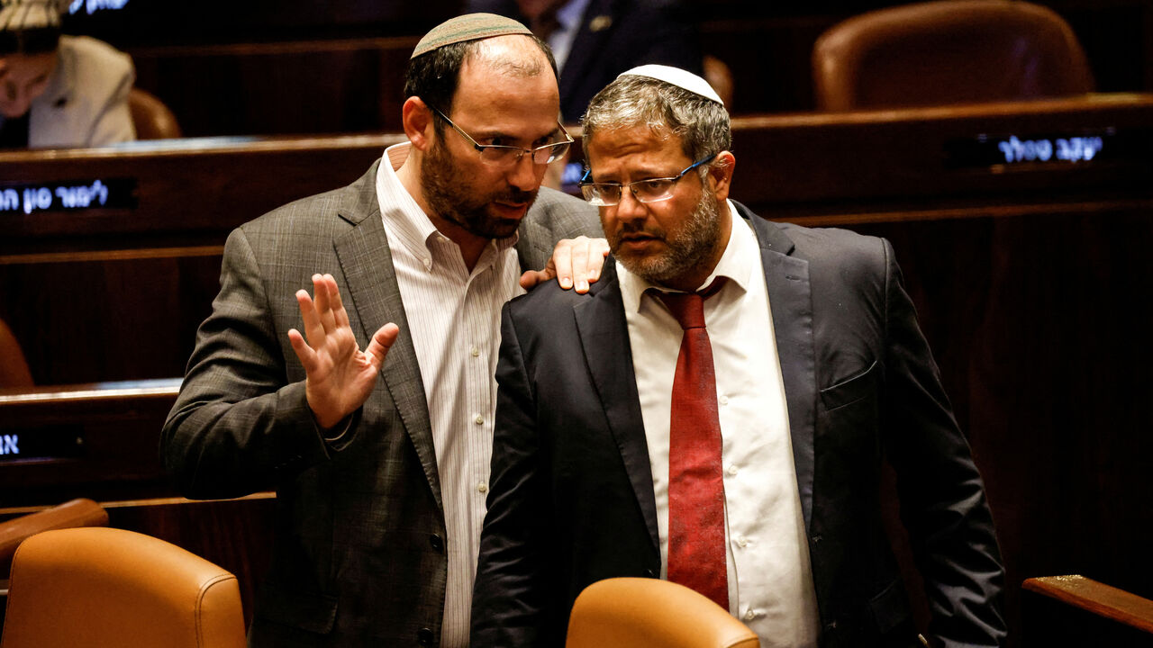 FILE PHOTO: Israeli National Security Minister Itamar Ben-Gvir and Head of the Knesset Constitution, Law and Justice Committee Simcha Rothman speak as lawmakers gather at the Knesset plenum to vote on a bill that would limit some Supreme Court power, in Jerusalem July 24, 2023. REUTERS/Amir Cohen/File Photo