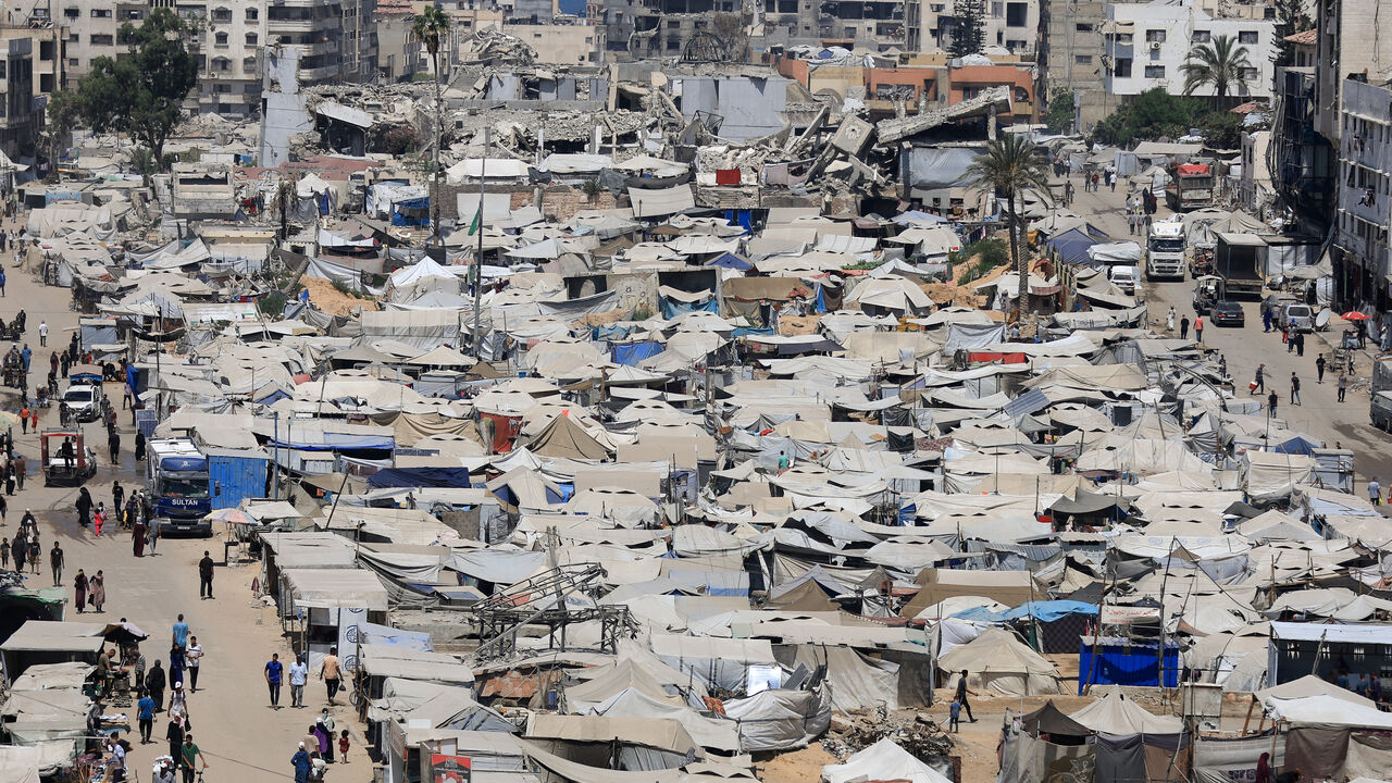 Palestinians, displaced by the Israeli offensive, shelter in a tent camp as the Israeli military prepares to relocate residents to southern Gaza, in Gaza City August 17, 2025. REUTERS/Dawoud Abu Alkas/File Photo