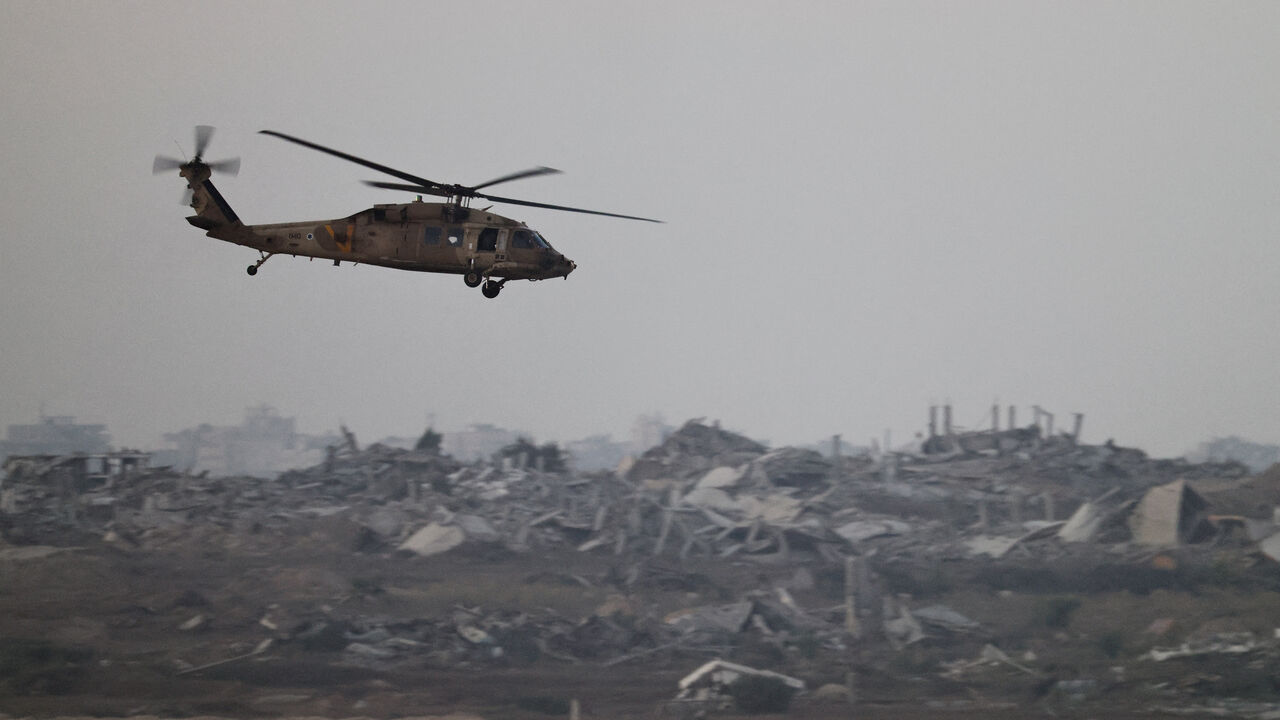 An Israeli Blackhawk evacuation helicopter flies over Gaza, as seen from the Israeli side of the border, Israel August 18, 2025. REUTERS/Amir Cohen