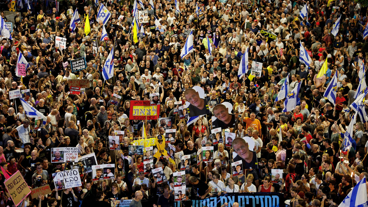 FILE PHOTO: Demonstrators attend a protest demanding the immediate release of the hostages kidnapped during the deadly October 7, 2023 attack on Israel by Hamas, and the end of the war, in Tel Aviv, Israel, August 9, 2025. REUTERS/Amir Cohen/File Photo