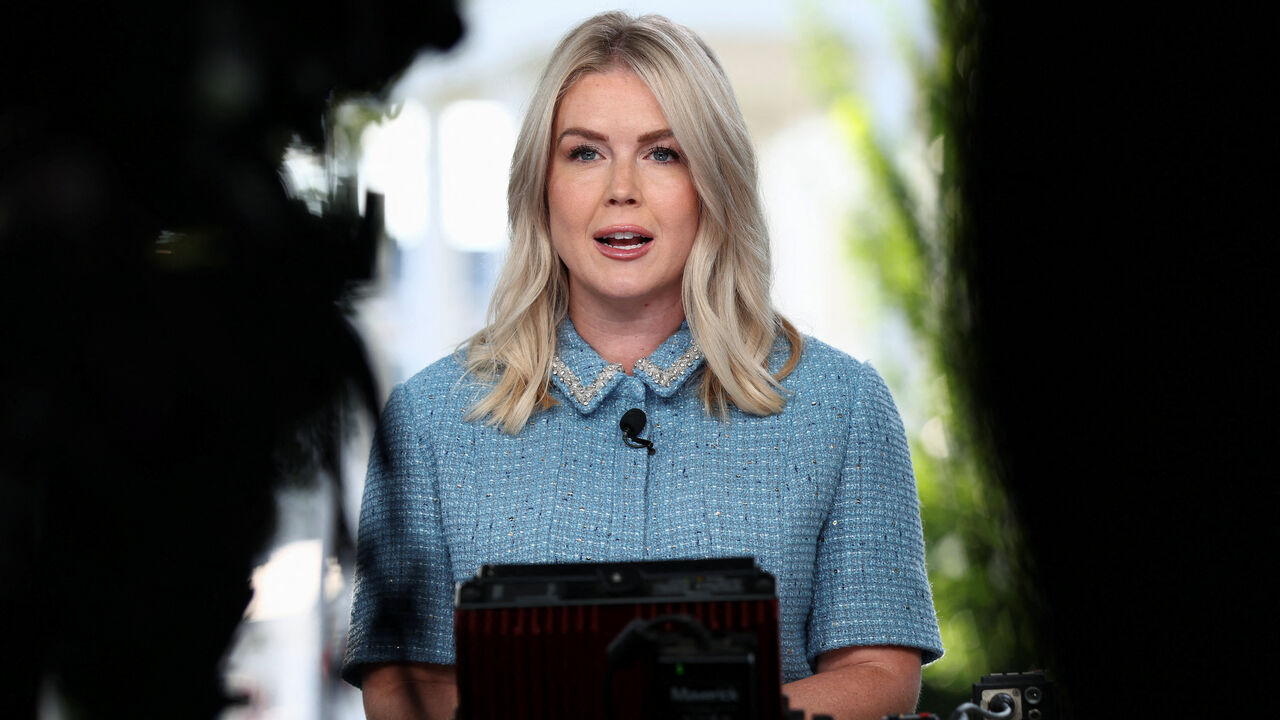 FILE PHOTO: White House Press Secretary Karoline Leavitt speaks before a TV news camera at the White House in Washington, D.C., U.S., August 14, 2025. REUTERS/Kevin Lamarque/File photo