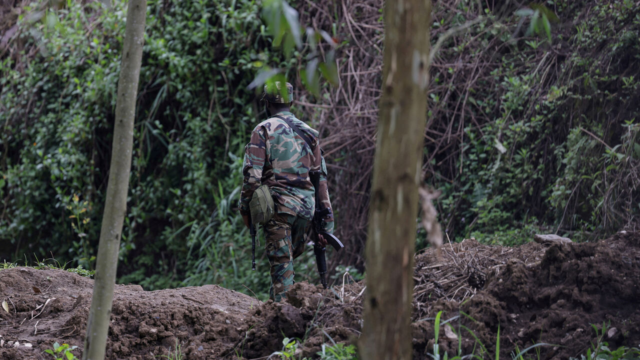 FILE PHOTO: A member of the M23 rebel group walks on the outskirts of Matanda in eastern Democratic Republic of Congo, March 22, 2025. REUTERS/Zohra Bensemra/File Photo