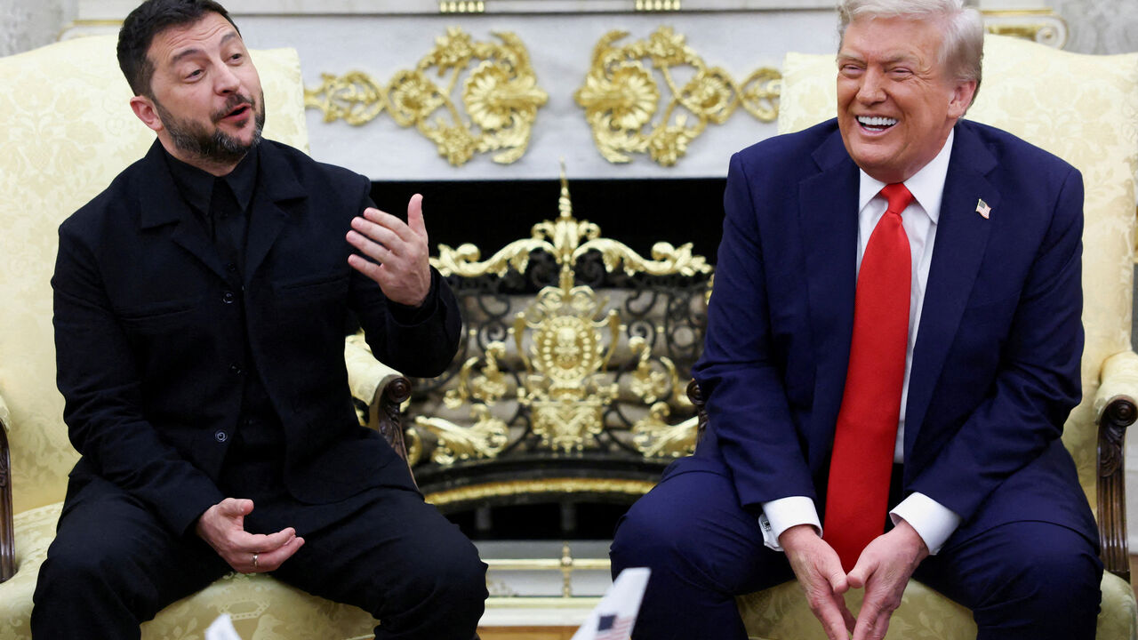 FILE PHOTO: Ukrainian President Volodymyr Zelenskiy gestures as U.S. President Donald Trump reacts during a meeting at the Oval Office of the White House, amid negotiations to end the Russian war in Ukraine, in Washington, D.C., U.S., August 18, 2025. REUTERS/Kevin Lamarque/File Photo
