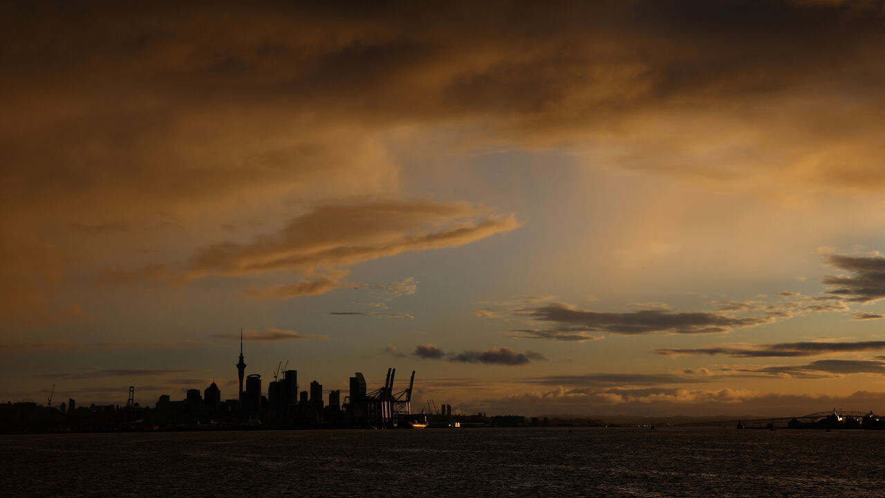 FILE PHOTO: The Auckland skyline is seen at sunset, New Zealand, August 12, 2023. REUTERS/Molly Darlington/File photo