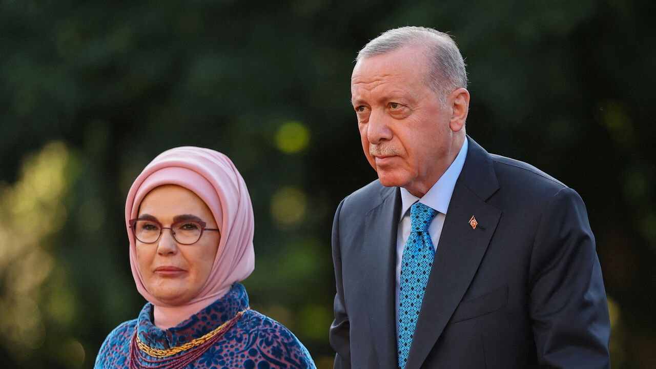 FILE PHOTO: Turkish President Recep Tayyip Erdogan and his wife Emine Erdogan arrive at a dinner for NATO heads of states and government hosted by Dutch King Willem-Alexander and Dutch Queen Maxima, on the sidelines of a NATO Summit, at Huis ten Bosch Palace in The Hague, Netherlands June 24, 2025. REUTERS/Toby Melville/File Photo