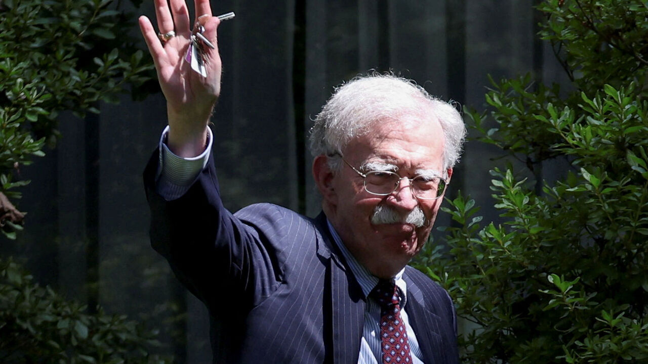 FILE PHOTO: Former White House national security adviser John Bolton arrives at his house following its search by the FBI in Bethesda, Maryland, U.S., August 22, 2025. REUTERS/Tasos Katopodis/File Photo