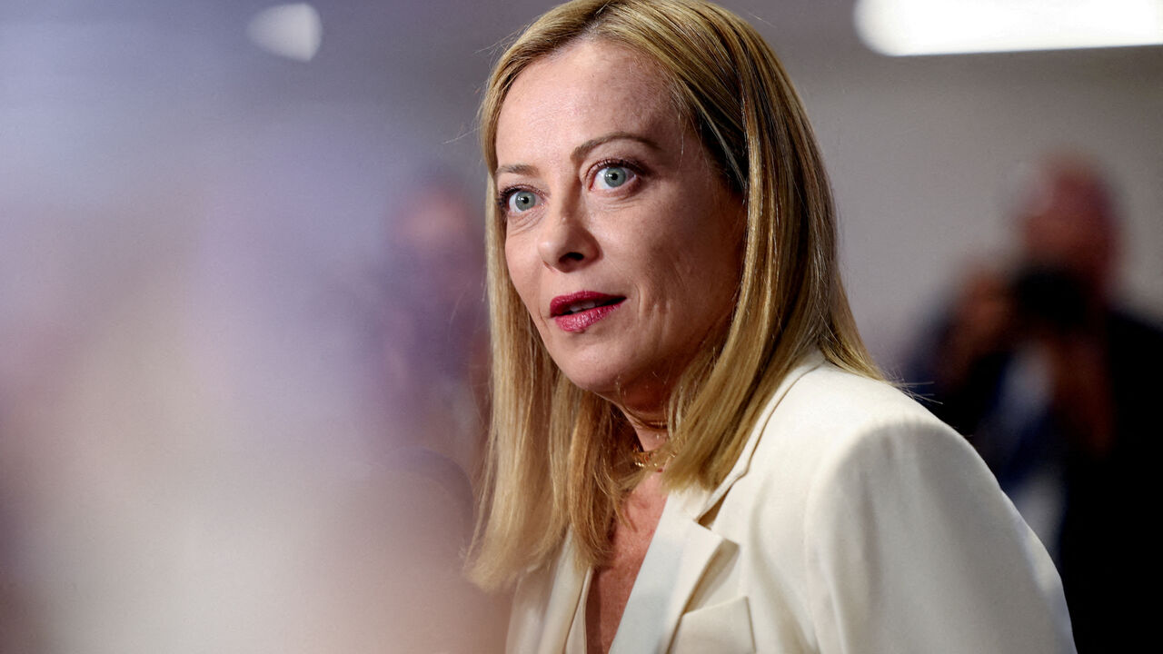FILE PHOTO: Italian Prime Minister Giorgia Meloni reacts as she speaks to the media at a NATO summit in The Hague, Netherlands June 25, 2025. REUTERS/Claudia Greco/File Photo
