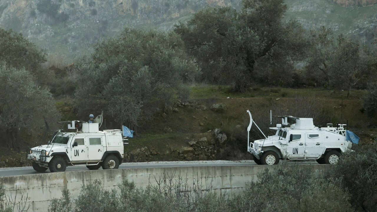 FILE PHOTO: UN peacekeepers (UNIFIL) vehicles ride along a street in Marjaayoun, Southern Lebanon January 20, 2025. REUTERS/Mohamed Azakir/File Photo