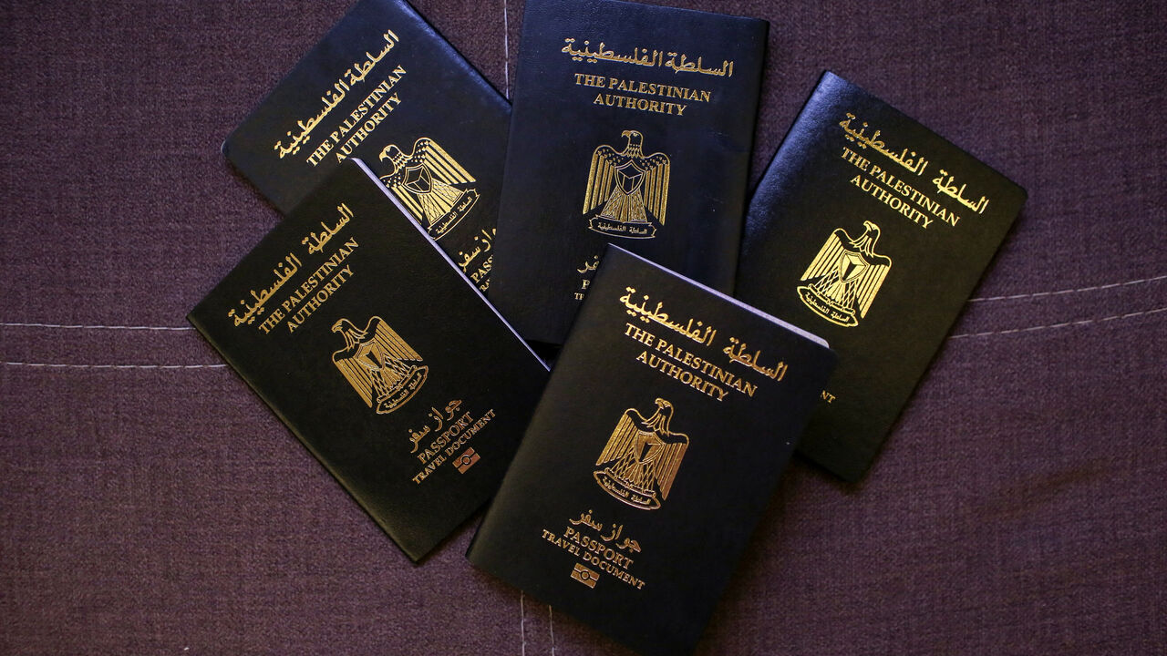 FILE PHOTO: Palestinian passports belonging to members of the Banat Gaza, which means "Girls of Gaza", after fleeing the war in Khan Younis, Gaza, following the events of October 7, 2023, are displayed in Obour City, Egypt July 15, 2025. REUTERS/Hadeer Mahmoud/File Photo