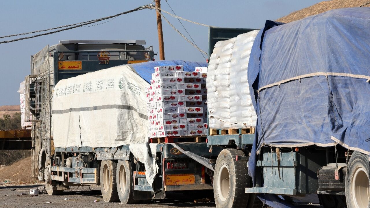 Trucks loaded with humanitarian aid for Palestinians in Gaza lie abandoned near the border with the Gaza Strip, close to the Kissufim crossing in southern Israel, on August 21, 2025