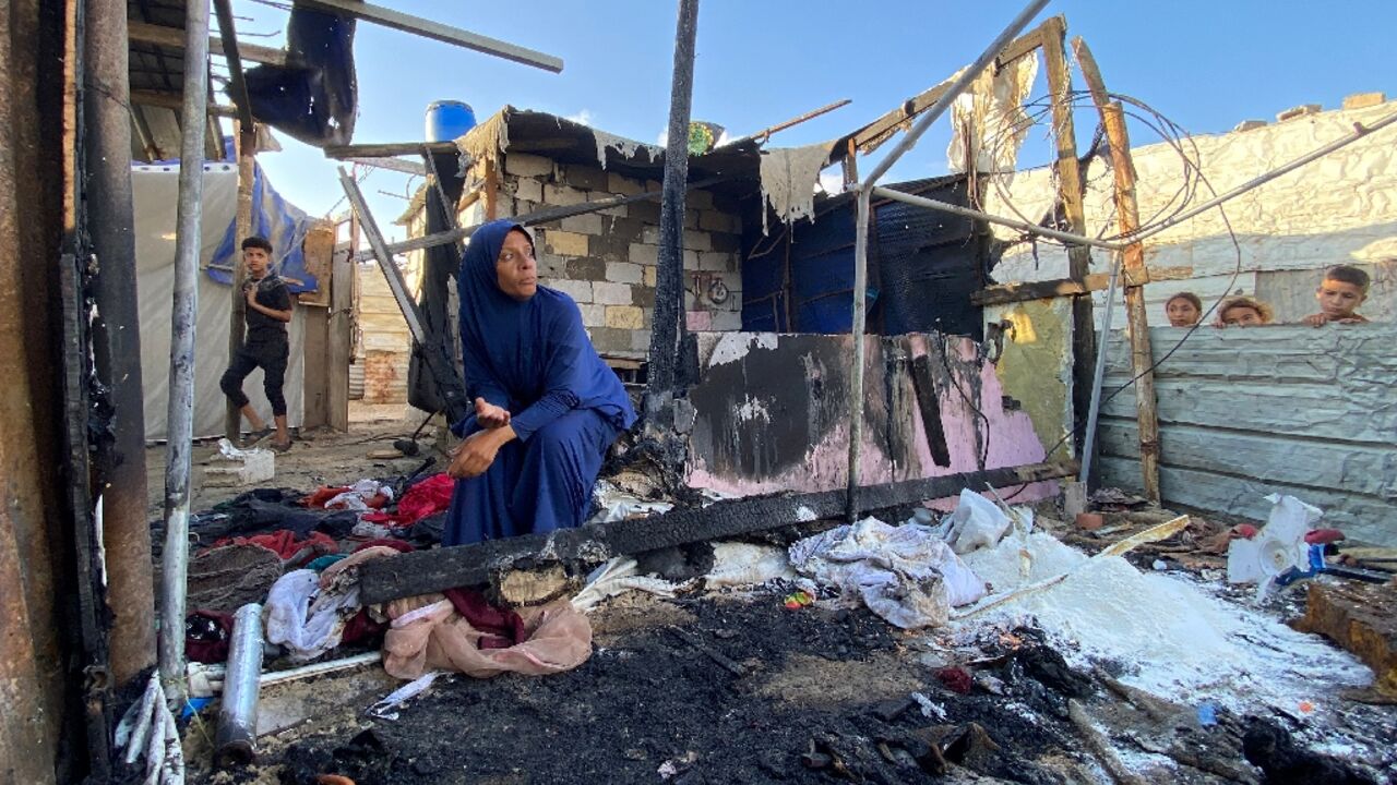 A Palestinian woman at the site of Israeli bombardment on the Al-Mawasi area in the southern Gaza Strip