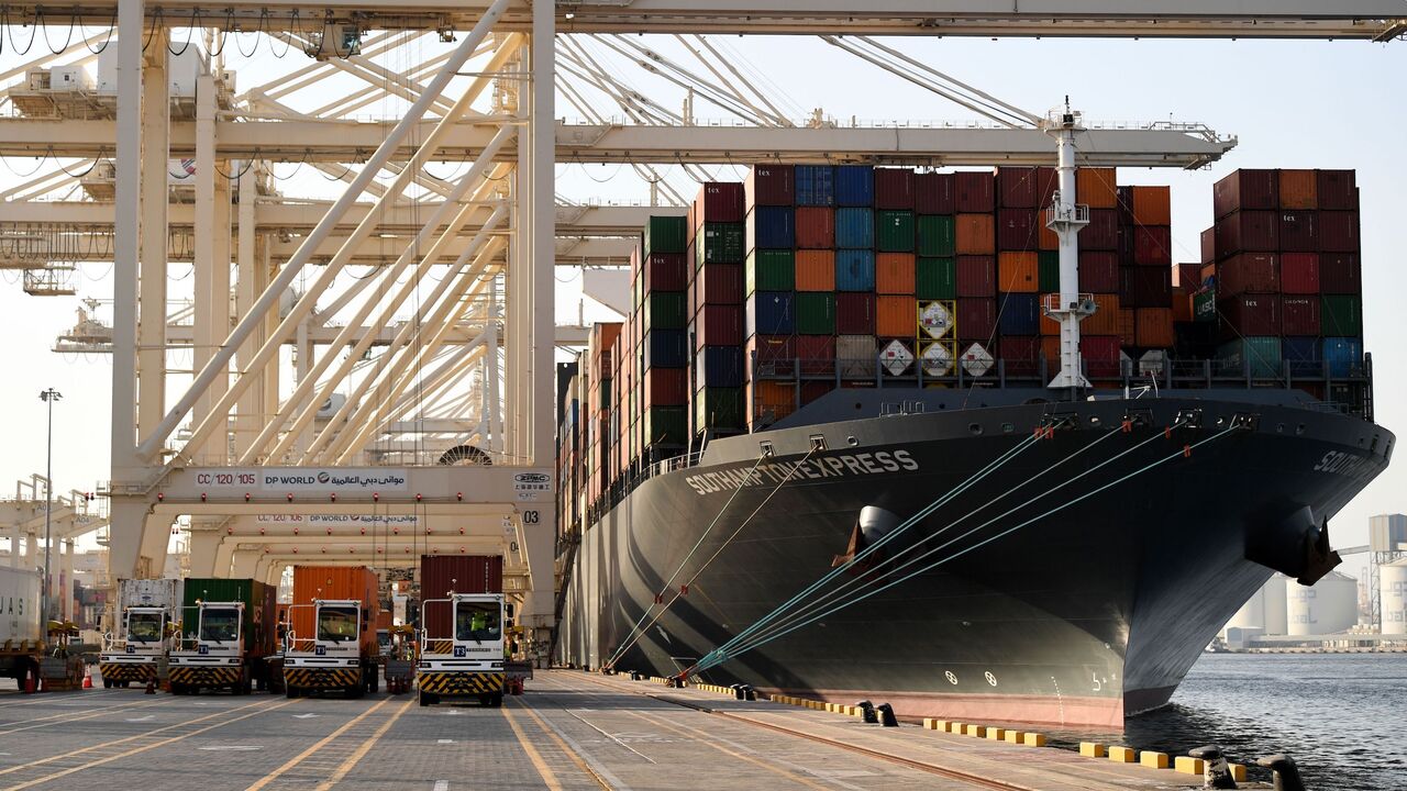 A container ship is docked at the port of Jebel Ali, operated by the Dubai-based giant ports operator DP World, in the southern outskirts of the Gulf emirate of Dubai, on June 18, 2020. 