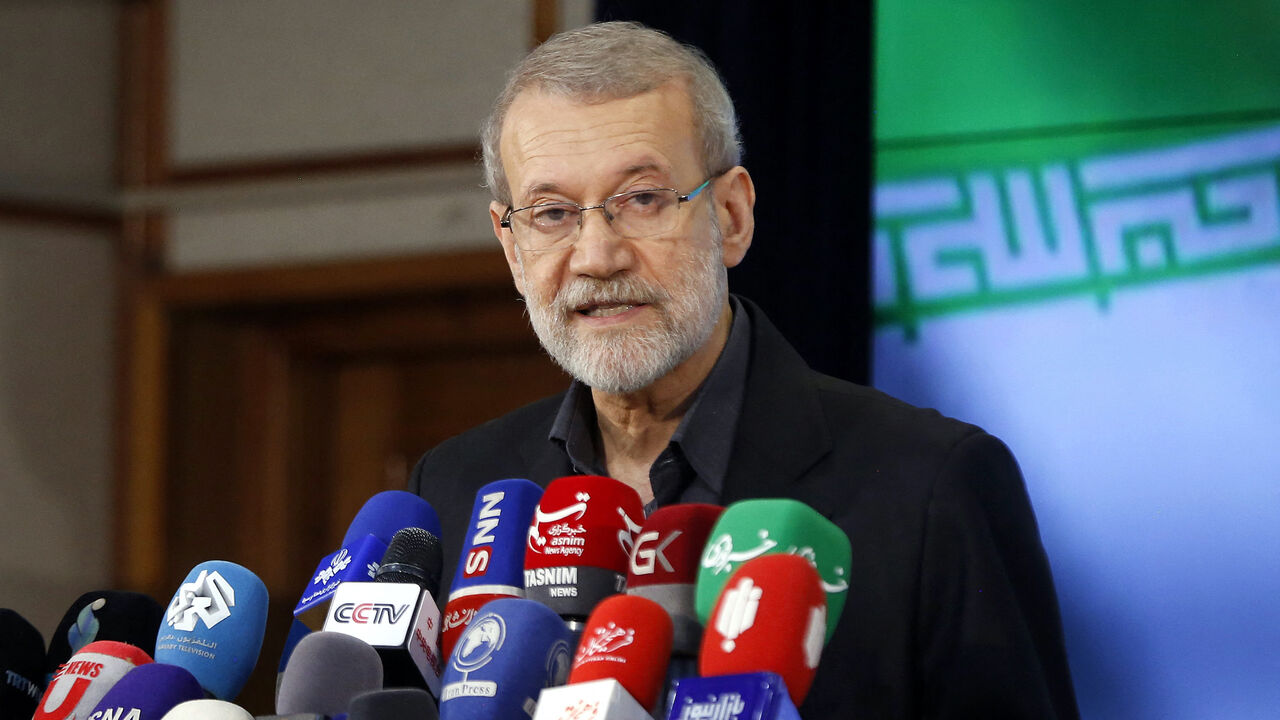 Former Iranian parliament speaker Ali Larijani addresses the media following his registration at the elections registration office in Tehran, on May 31, 2024, ahead of the country's election of a new president next month. 