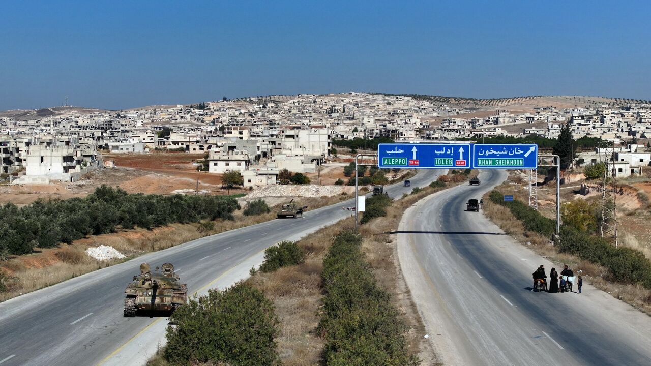 An aerial view shows a tank, left behind by regime forces, on the road leading to the Syrian town of Khan Sheikhun, in the northwestern Syrian Idlib province, on Dec. 1, 2024.
