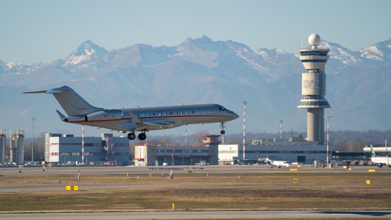 VistaJet Bombardier Bombardier Global 6000 is landing at Milano Malpensa international airport.