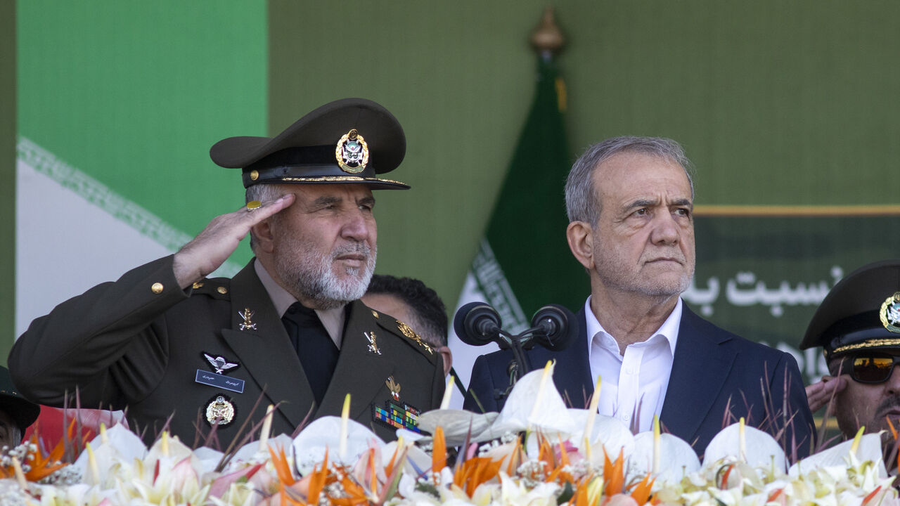 Iranian President Masoud Pezeshkian (R) makes a speech as he attends the National Army Day ceremony on April 18, 2025 in Tehran, Iran. 
