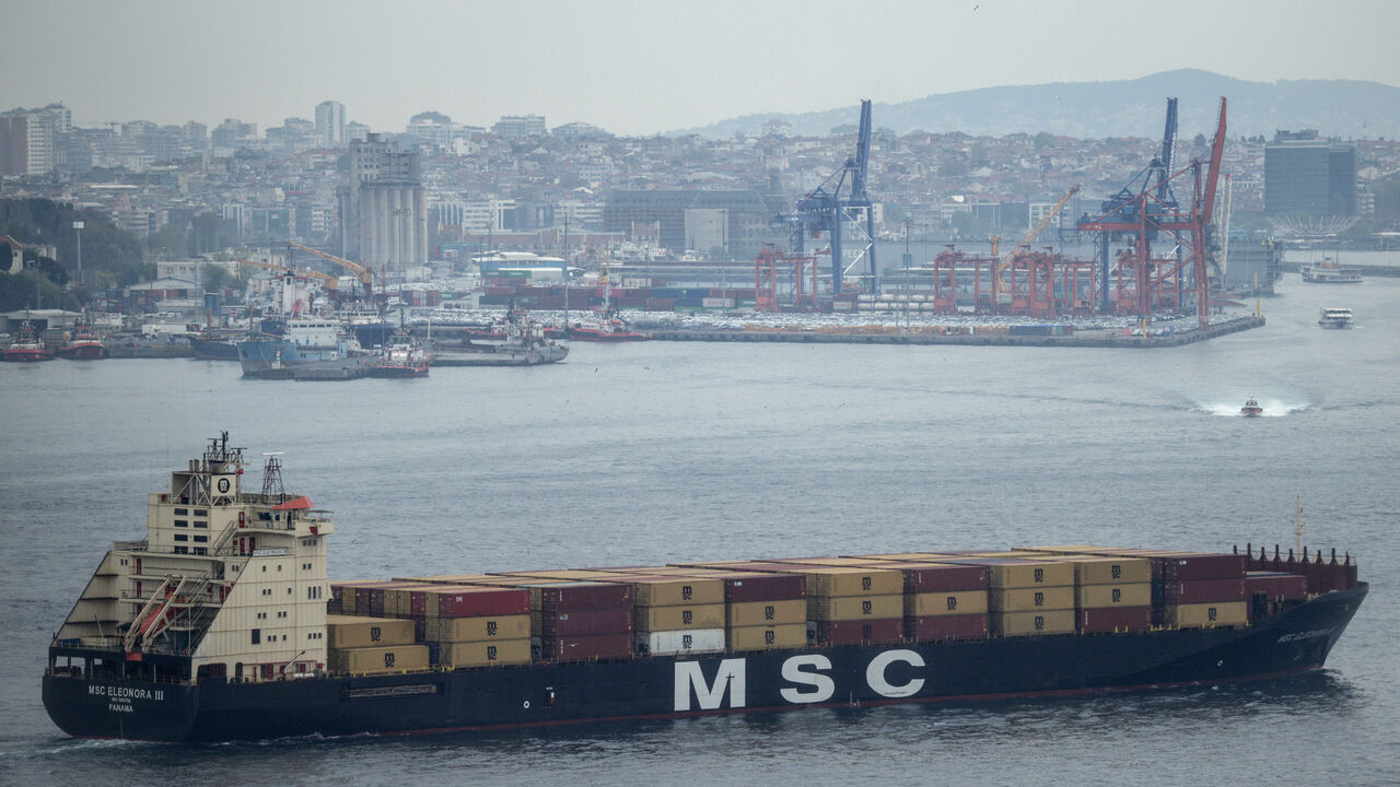 A container ship passes in front of Haydarpasa Port as it navigates the Bosphorus Strait on May 2, 2025 in Istanbul, Turkey.