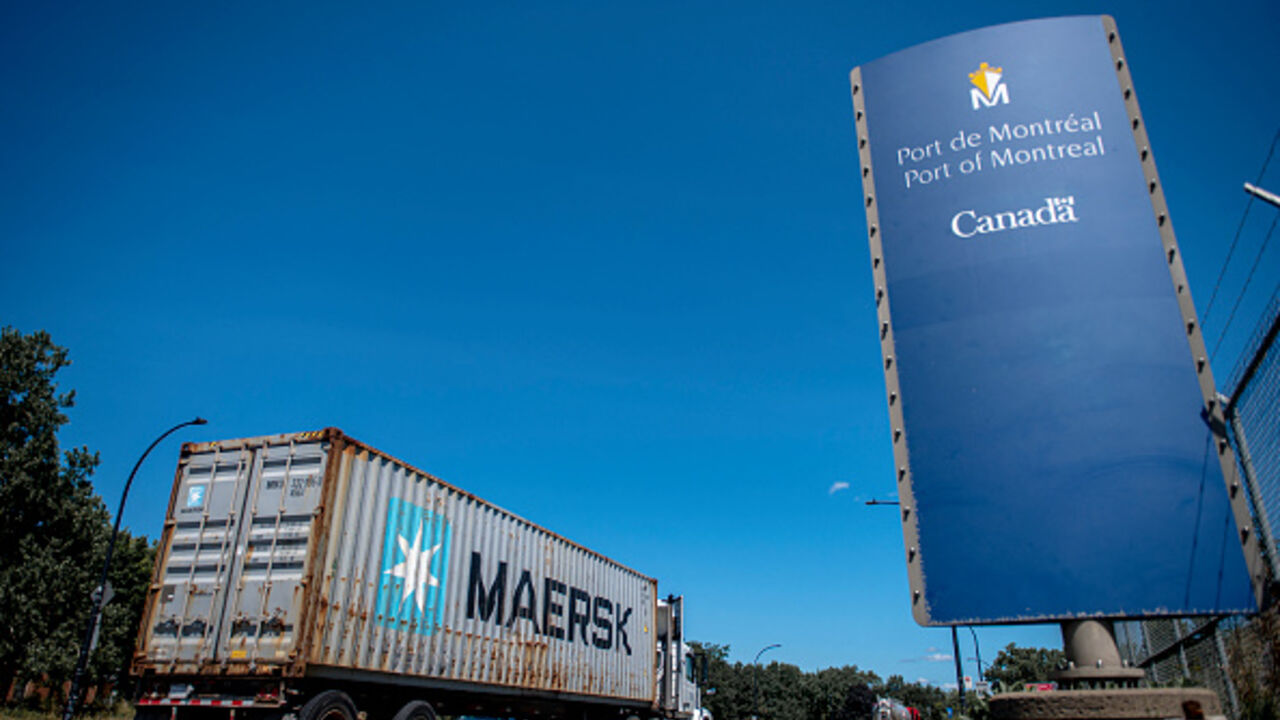 A truck with a container leaves the Port of Montreal in Montreal, Quebec, Canada, on August 1, 2025. US President Donald Trump unveiled new tariffs on July 31 on nearly 70 countries -- including a blistering 35 percent on neighbor Canada -- as he seeks to reshape global trade to benefit the US economy. However, in a minor reprieve that opens the door to further negotiations, the White House said the measures will take effect in a week for most countries, not Friday as previously expected. (Photo by ANDREJ I