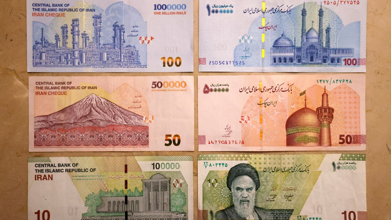 This picture shows old Iranian banknotes of 1 million, 500,000,and 100,000 rials (L), and the new banknotes with four zeros removed (R), on Aug. 3, 2025. 