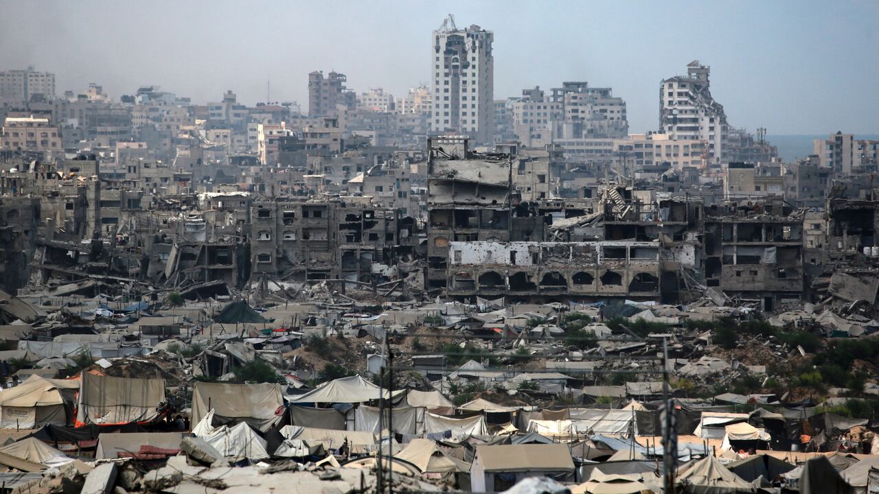 Tents used as temporary shelters by displaced Palestinians are set up near war-damaged buildings in Gaza City on Aug. 8, 2025.