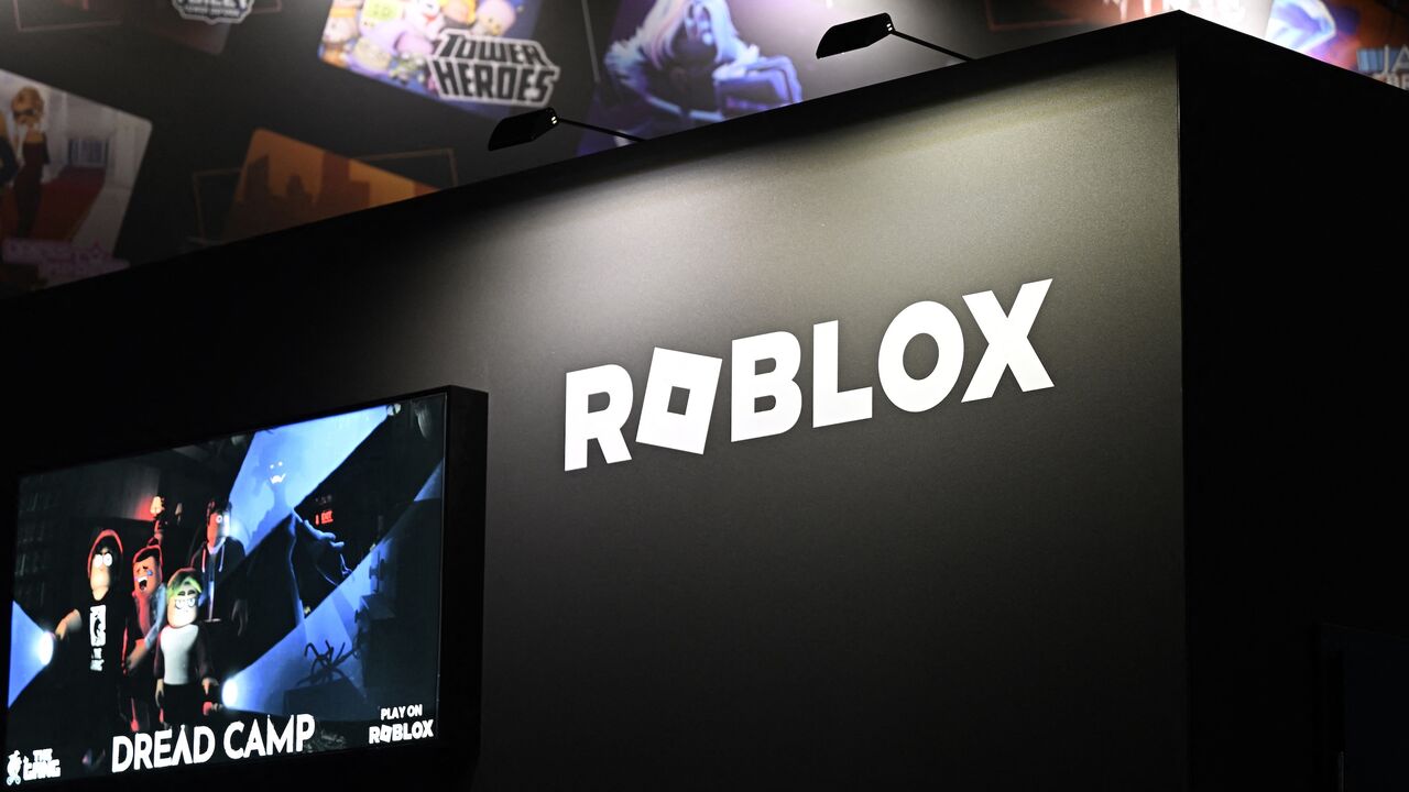 The logo of the online game platform and game creation system Roblox at a booth during Gamescom, a video games trade fair, Cologne, Germany, Aug. 21, 2025.