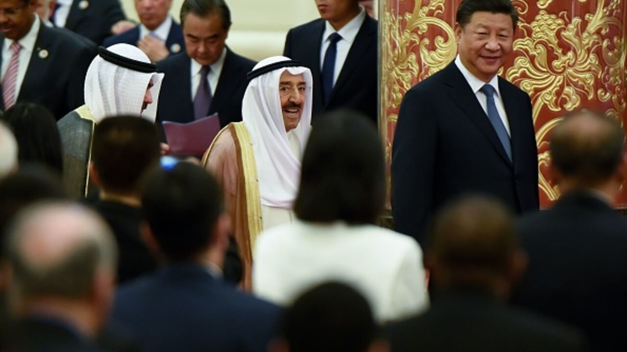 China's President Xi Jinping (R) and Kuwaiti ruling Emir Sheikh Sabah al-Ahmad al-Jaber al-Sabah (C) arrive for the 8th Ministerial Meeting of China-Arab States Cooperation Forum at the Great Hall of the People in Beijing on July, 10, 2018.