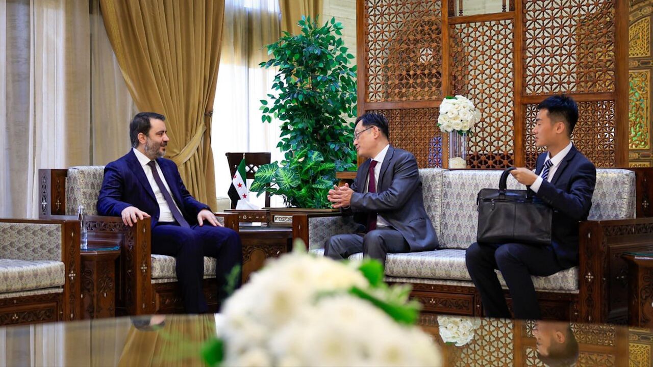 Syrian Foreign Minister Asaad al-Shibani (L) meets with Chinese ambassador to Damascus Shi Hongwei in Damascus on July 29, 2025.