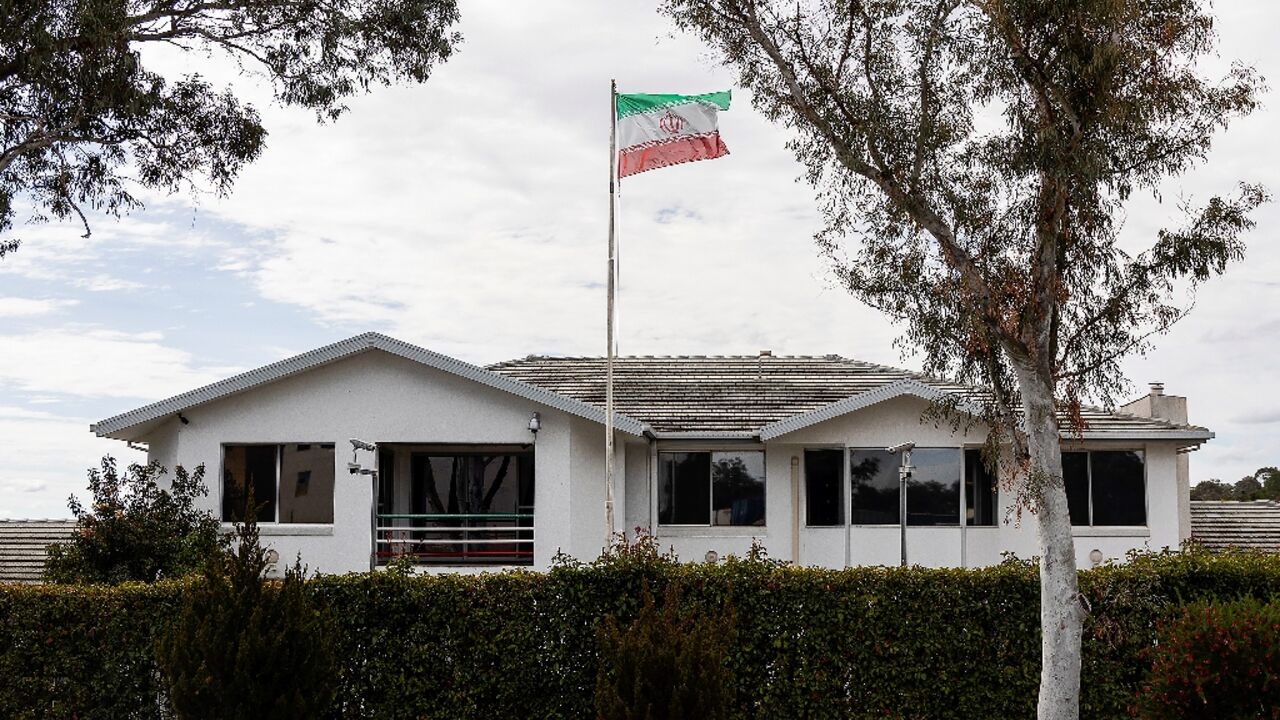 The Iranian national flag flies over the Iranian embassy building in Canberra on August 26, 2025