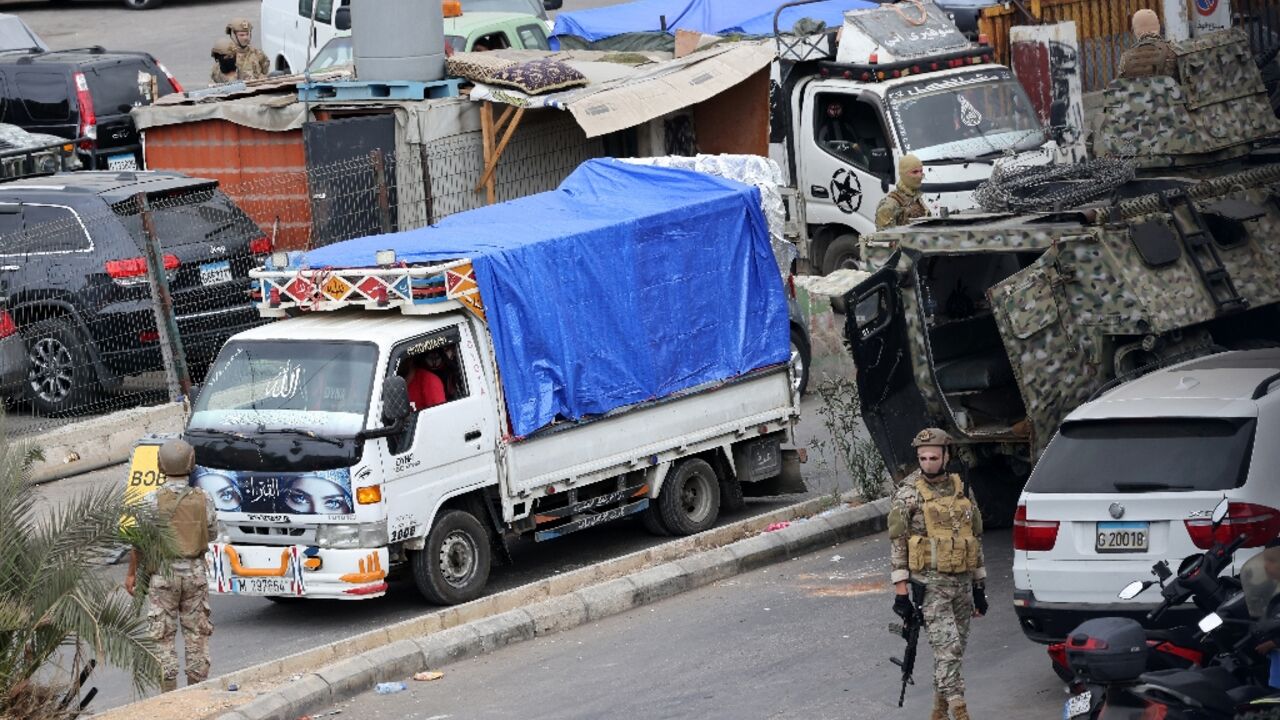Trucks loaded with Palestinian weapons pull out of the Burj al-Barajneh camp in the Lebanese capital, completing the disarmament of Palestine Liberation Organisation factions in Beirut refugee camps.