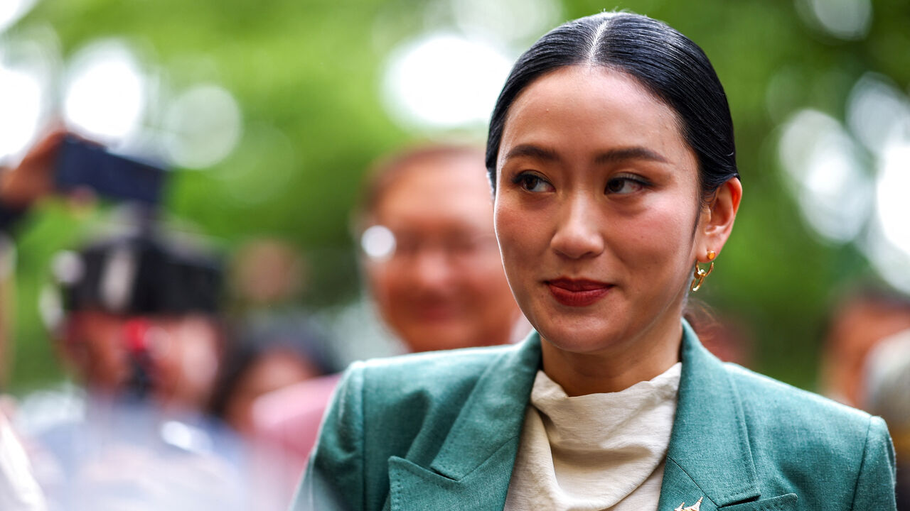 FILE PHOTO: Thailand’s Prime Minister Paetongtarn Shinawatra reacts as she arrives ahead of a cabinet meeting at the Government House, in Bangkok, Thailand, July 1, 2025. REUTERS/Athit Perawongmetha/ File Photo