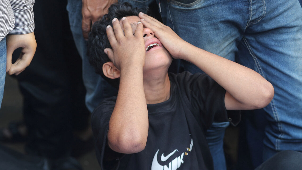 A boy mourns during the funeral of Palestinians killed in overnight Israeli strikes, according to medics, at Al-Shifa Hospital in Gaza City, September 1, 2025. REUTERS/Mahmoud Issa