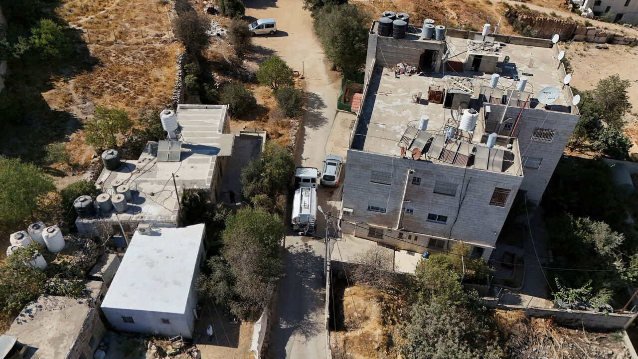 A drone view shows a water tanker delivering water to houses in Hebron in the Israeli-occupied West Bank, August 23, 2025. REUTERS/Yosri Aljamal
