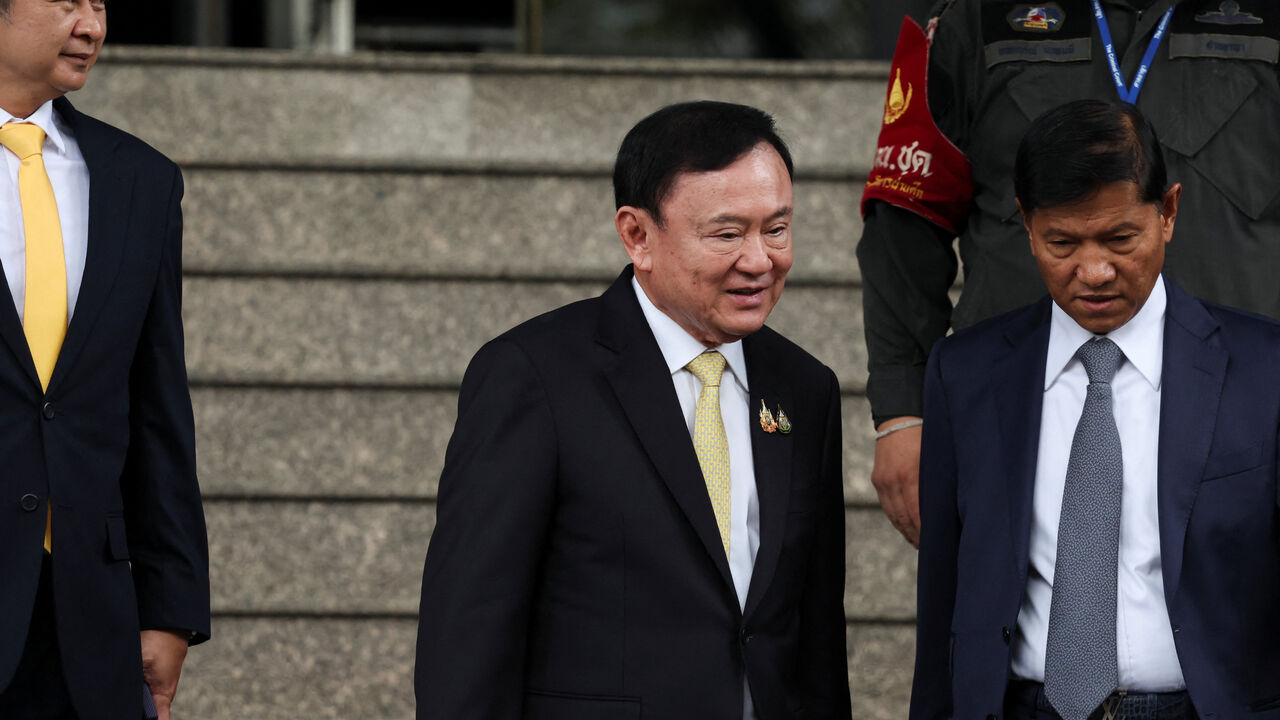 FILE PHOTO: Former Thai Prime Minister Thaksin Shinawatra leaves after a Thai criminal court cleared him of charges in a lese majeste case, also known as a royal insult case, under Section 112 of Thailand's Criminal Code, stemming from a 2015 interview he gave while in South Korea during his long stint in self-imposed exile, in Bangkok, Thailand, August 22, 2025. REUTERS/Chalinee Thirasupa/File Photo