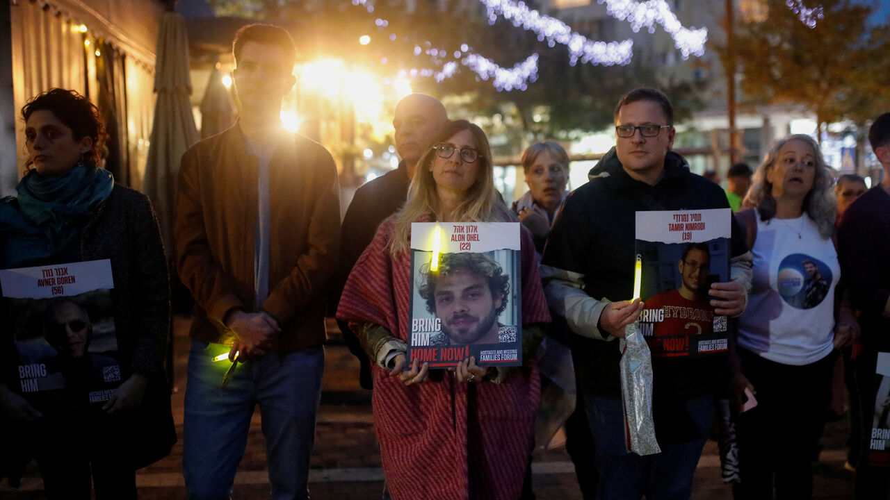 FILE PHOTO: Idit Ohel, mother of Alon Ohel, 22, who was taken hostage by Palestinian Islamist group Hamas during the deadly October 7 attack, and her family gather with other families of hostages to light candles to mark the first night of the Jewish holiday of Hanukkah, in Karmiel, in northern Israel  December 7, 2023. REUTERS/Shir Torem/File Photo